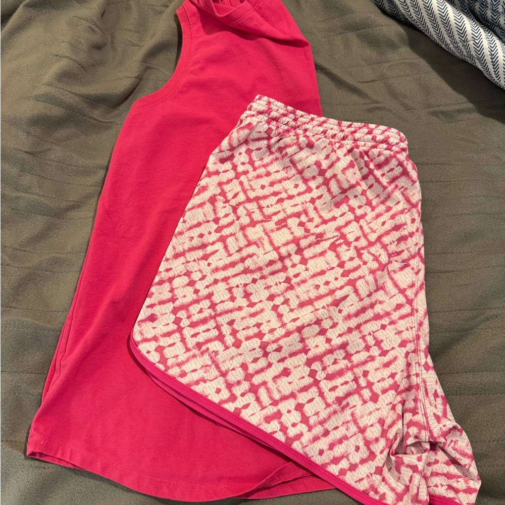 ZELOS Pink Athletic Shorts with Geometric Design paired with a Woman Within top